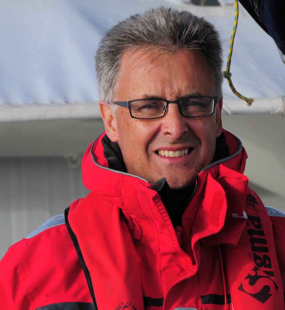 Professor Craig Johnson in a red jacket 