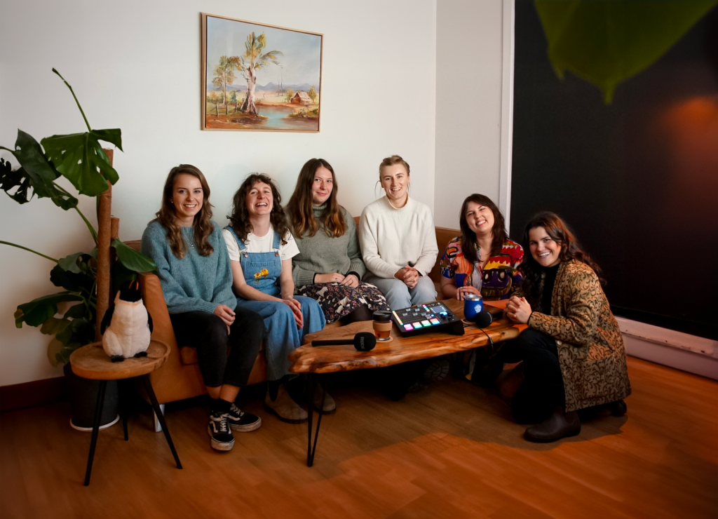 group of girls sitting on a couch