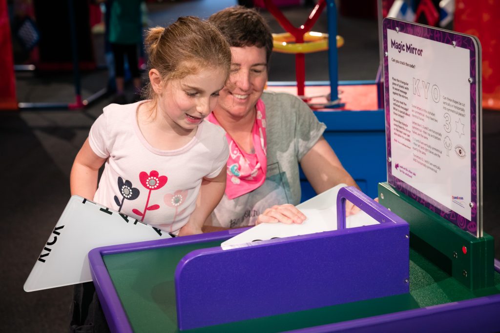 You girl and mother exploring the Questacon exhibition.